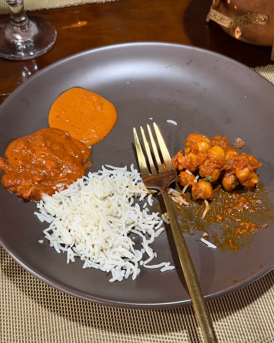 Plate holding three curries side by side