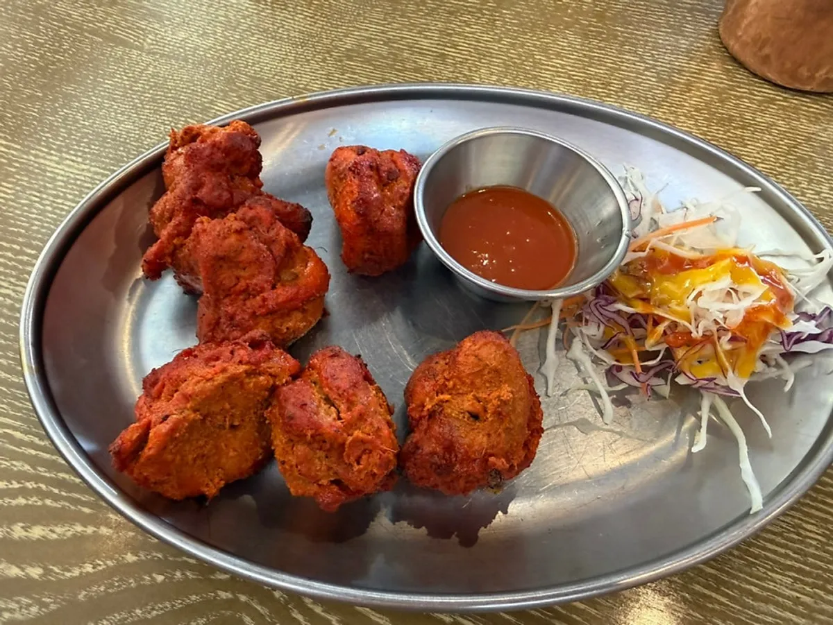 Lunch set table setting with salad and chicken tikka