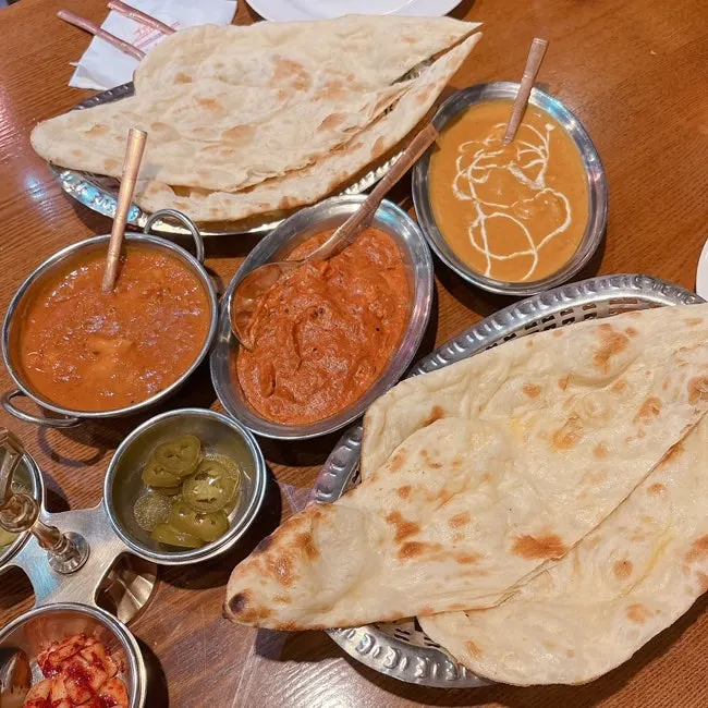 A full spread of curry and naan