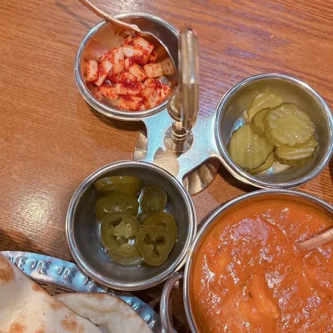 Jalapeños, pickles, and kimchi side dishes