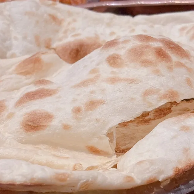 Large naan baked in a tandoor