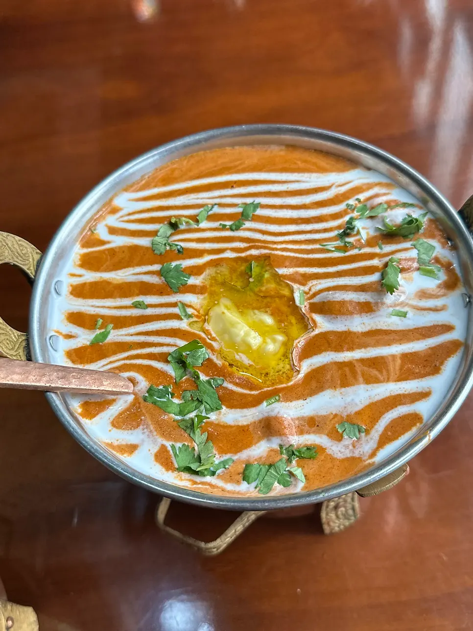 Two curries and butter naan ordered for one