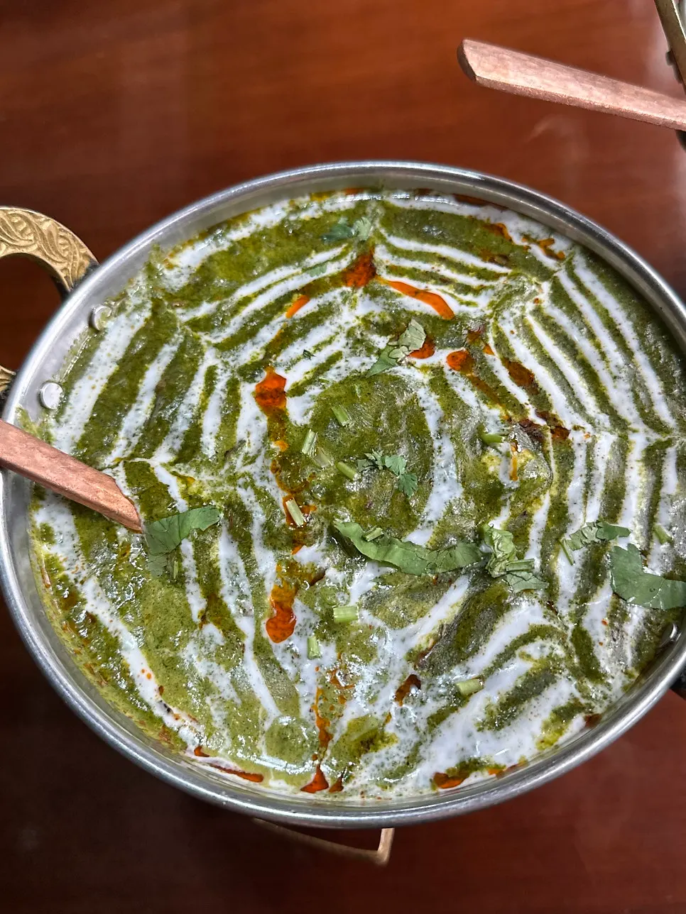 Butter chicken eaten with naan