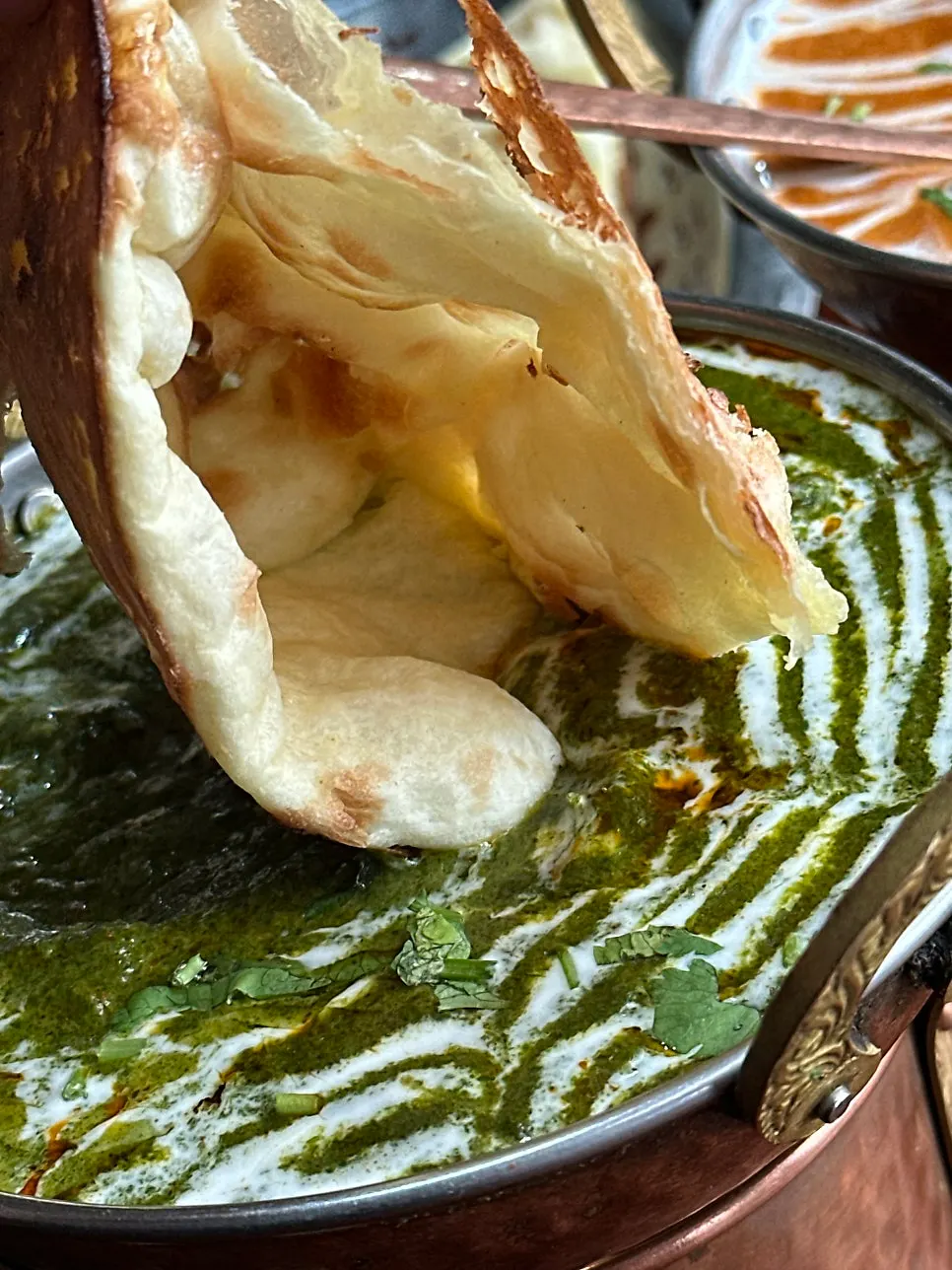 Deep green palak paneer curry