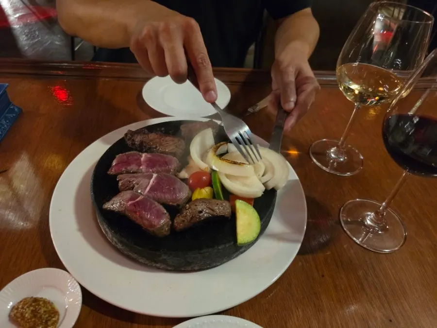 Rare steak on a hot stone plate