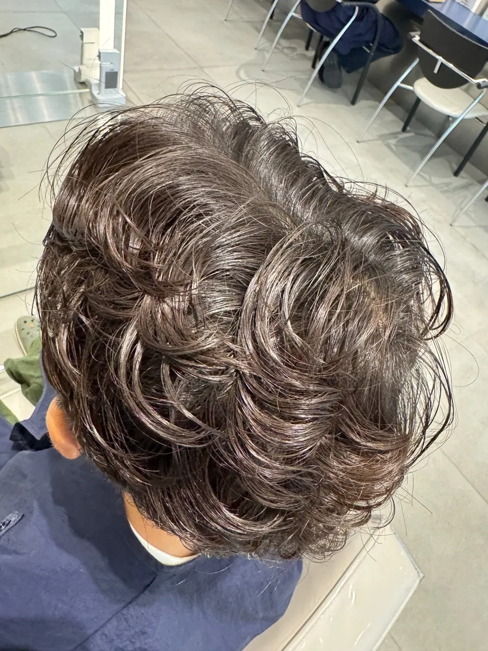 Boy's hair with natural curl after the junior perm
