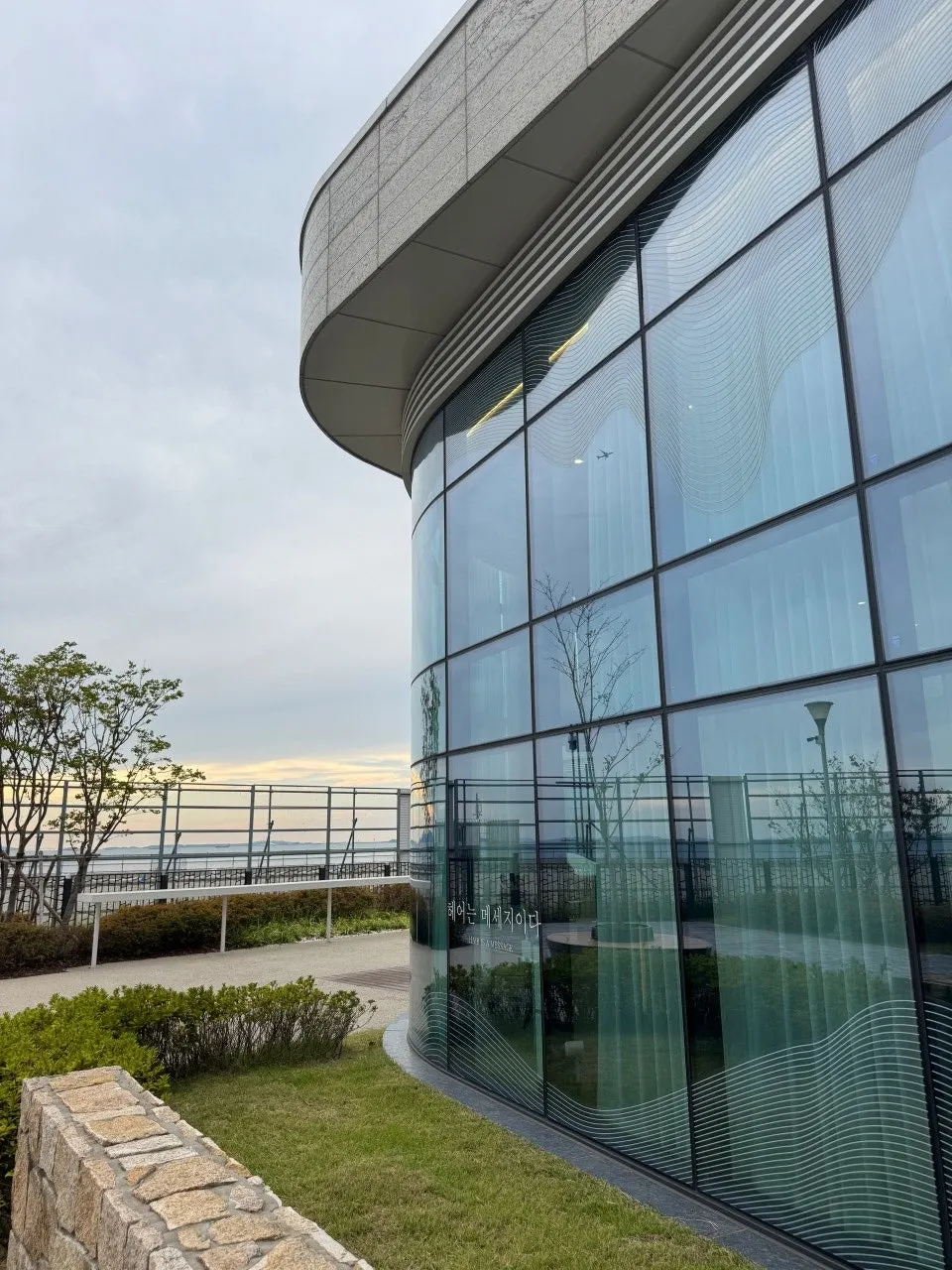 Exterior of the Songdo hair salon with an ocean-view window