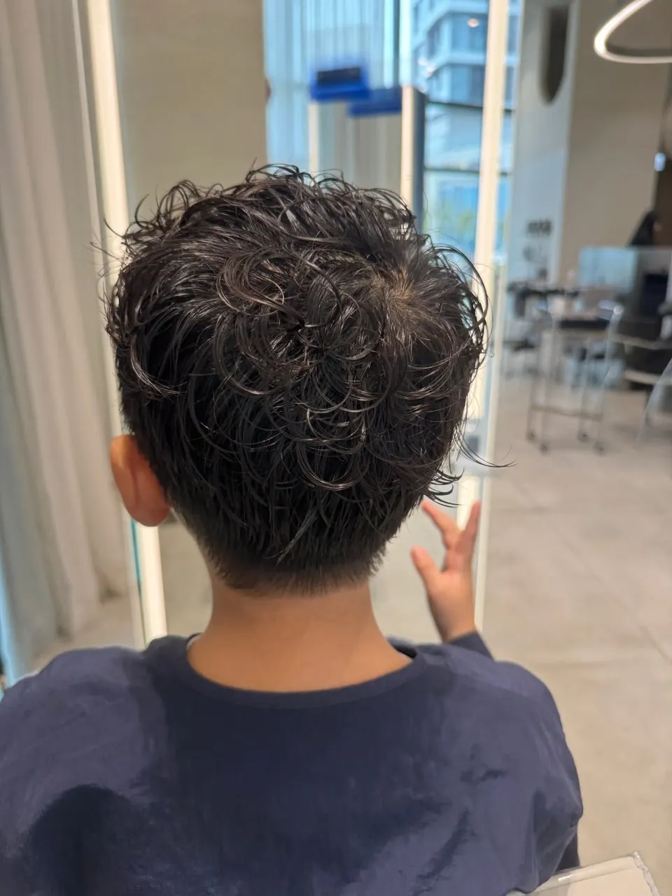 Wet junior perm curls before blow-drying