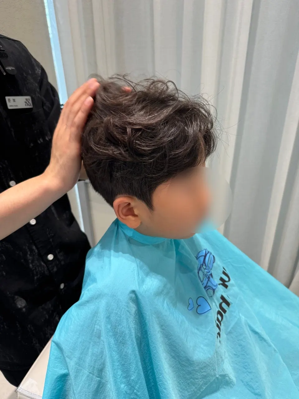 Finished junior perm styled with a blow-dryer