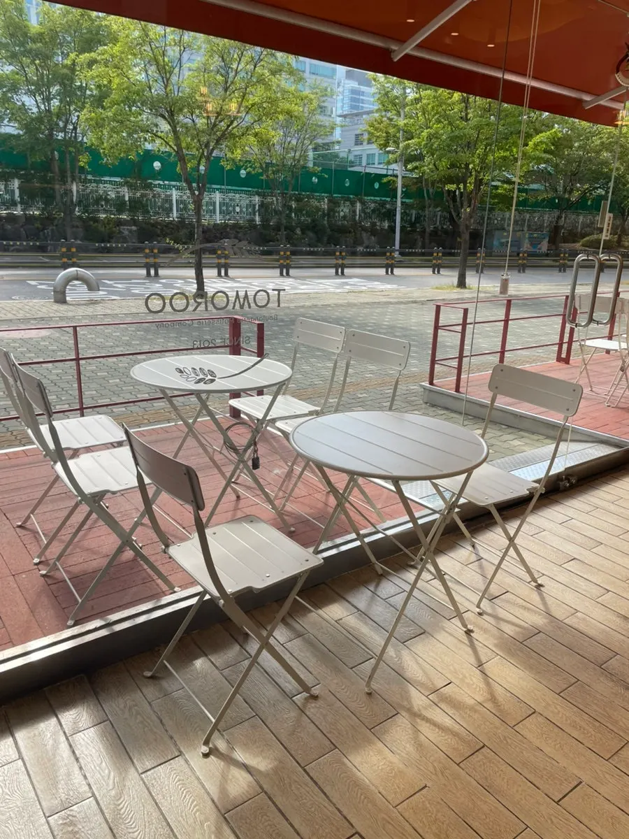 Outdoor seating area in front of the bakery on a sunny day