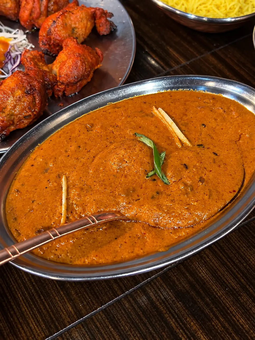A bowl of creamy butter chicken curry