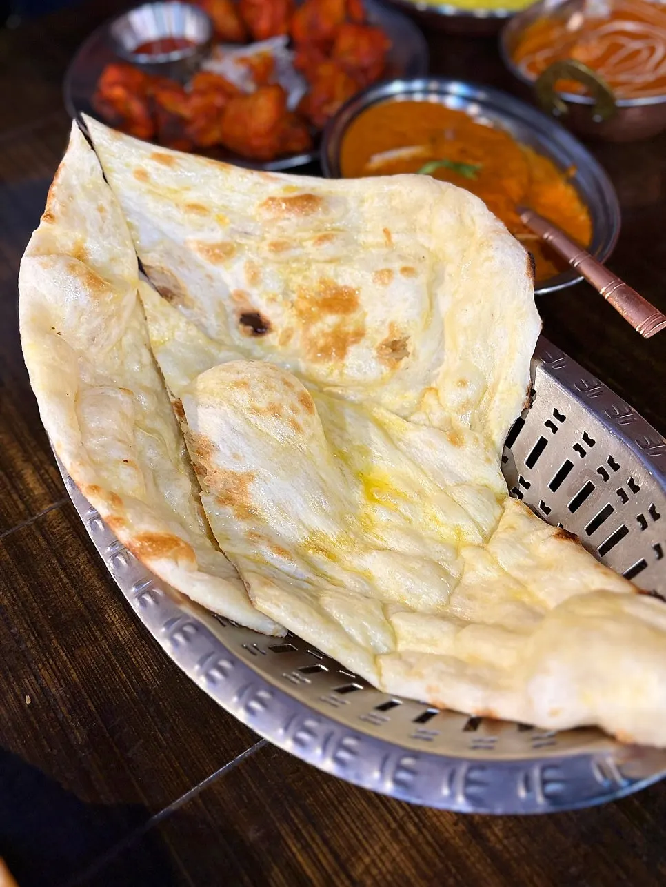 Clay-oven baked butter naan and garlic naan