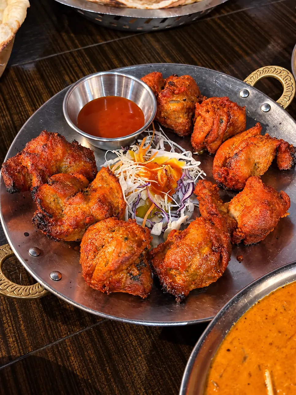 Chicken tikka served with a side salad