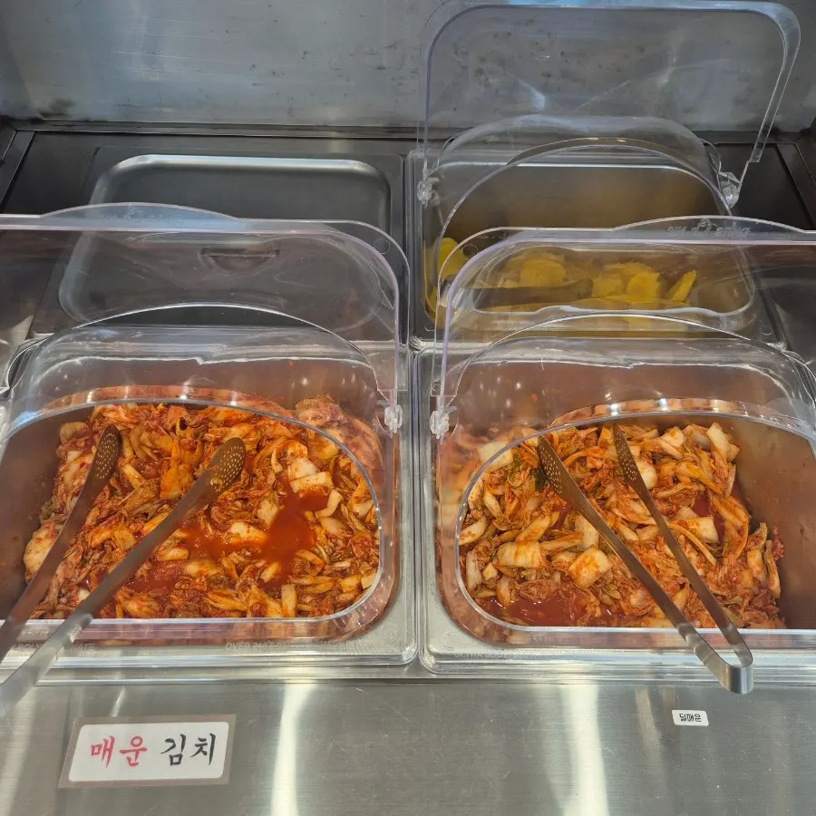 Self-serve bar with pickled radish and kimchi