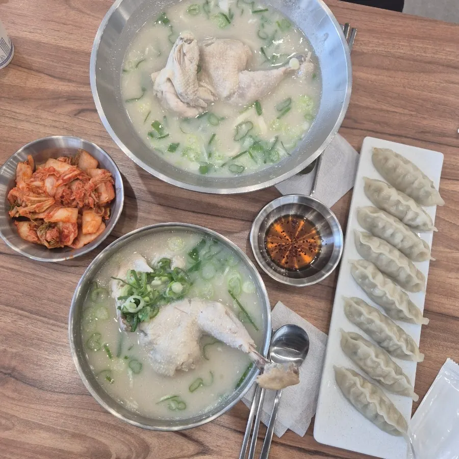 Table set with chicken kalguksu and dak gomtang