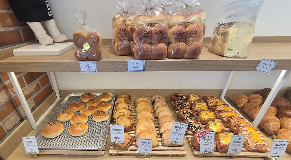 Bread varieties on display at Tomoru Bakery