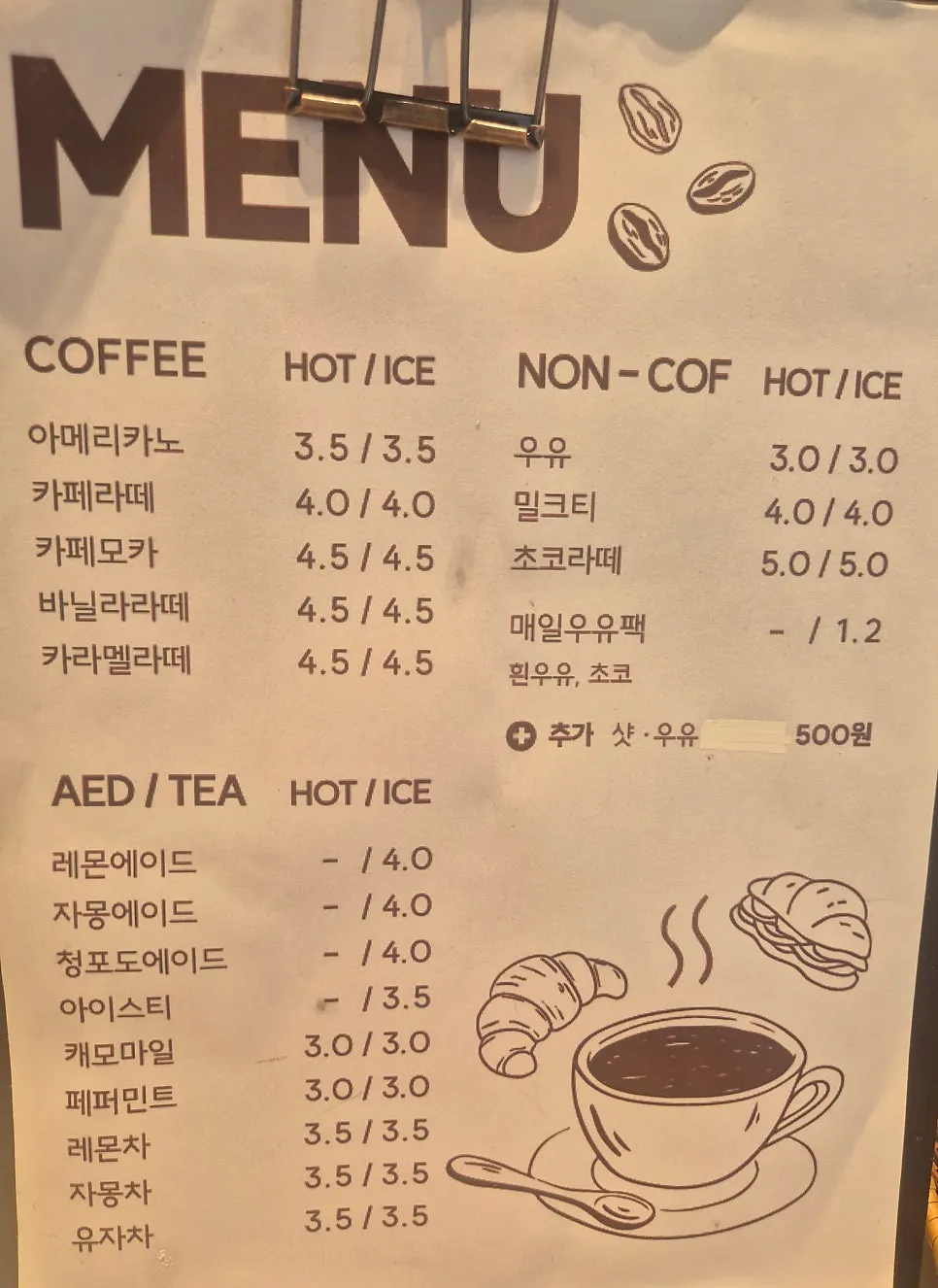 Drink menu board at Tomoru Bakery