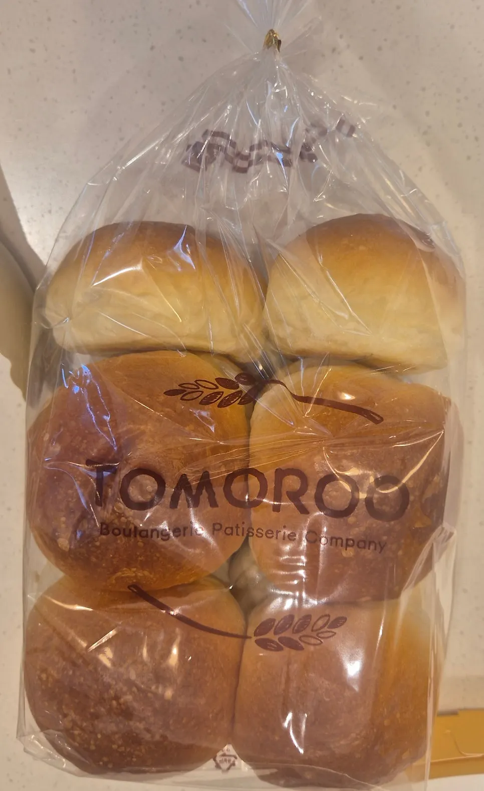 Bag of breads picked out at Tomoru Bakery