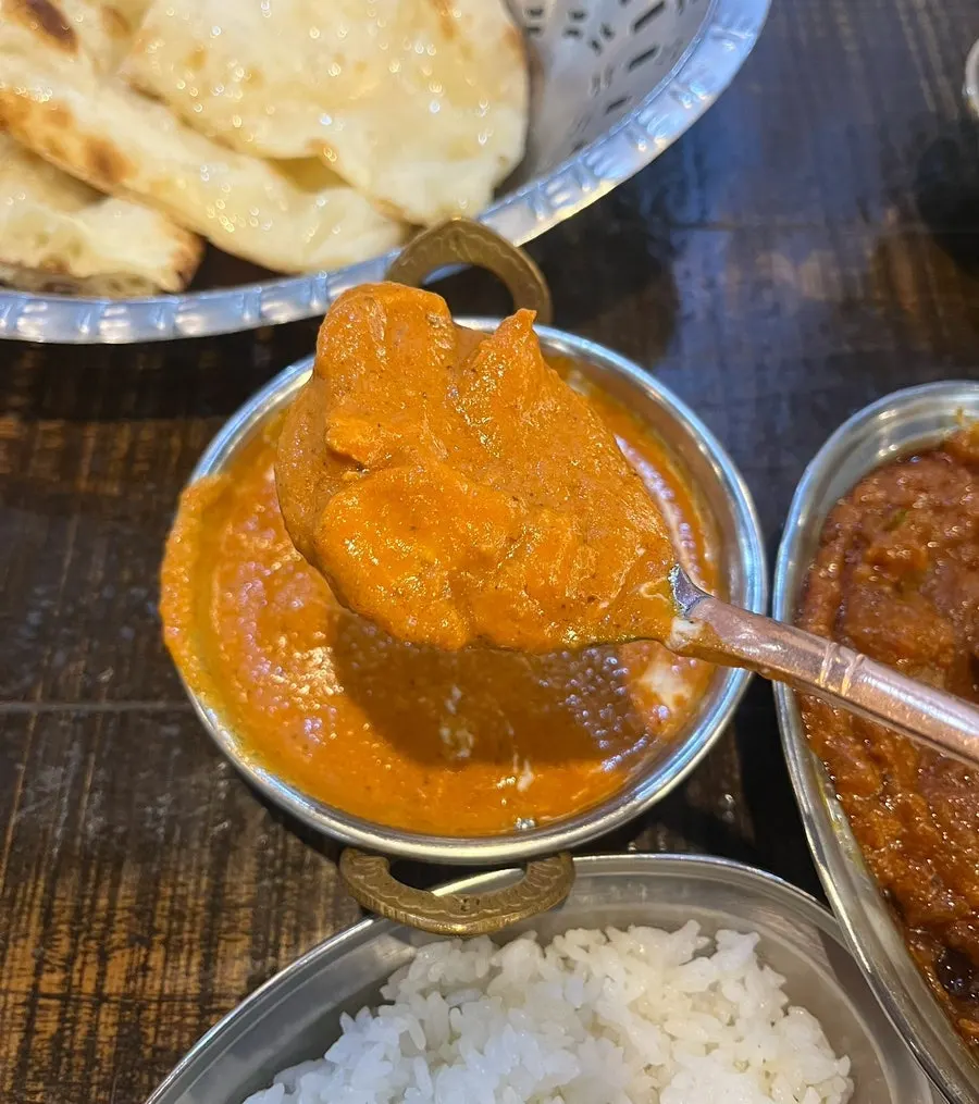 Close-up of the creamy tomato-based butter chicken