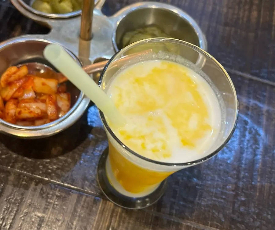 A glass of Manokamana's mango lassi