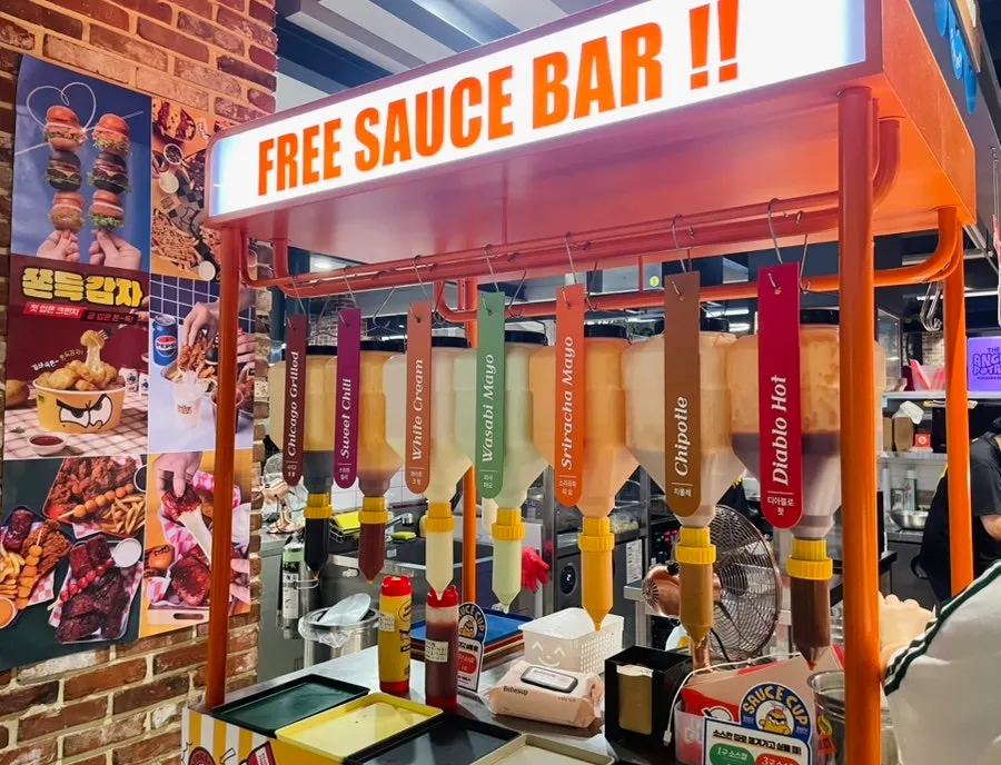 Corner display of potato chips and various sauces