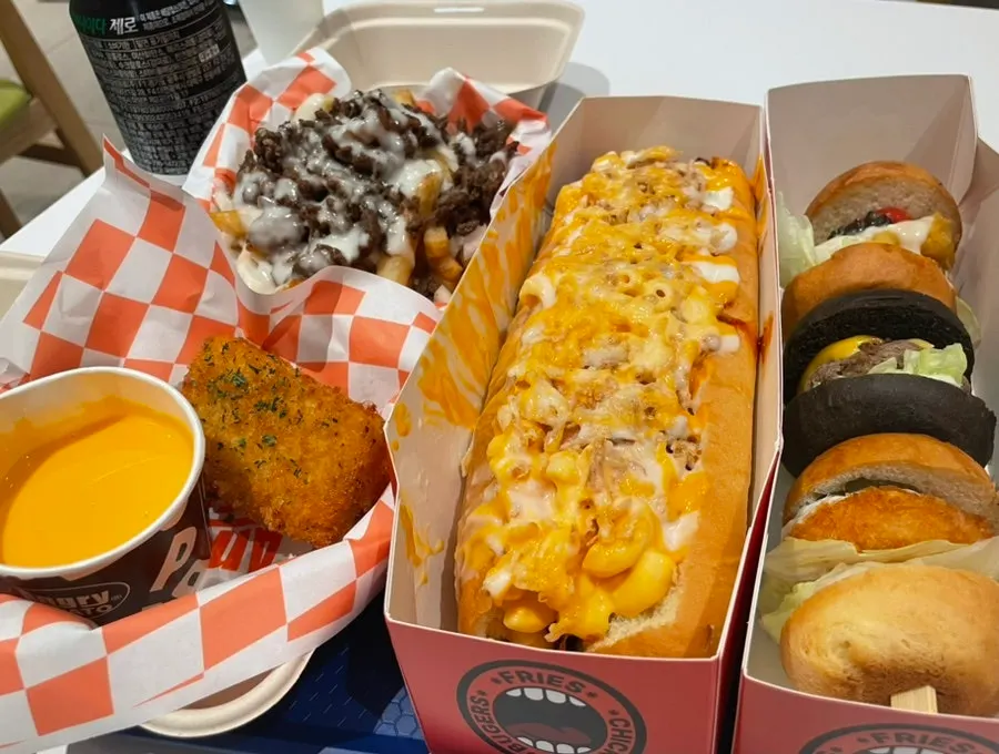 Angry Potato menu board listing fries, mini burgers, and hot dogs