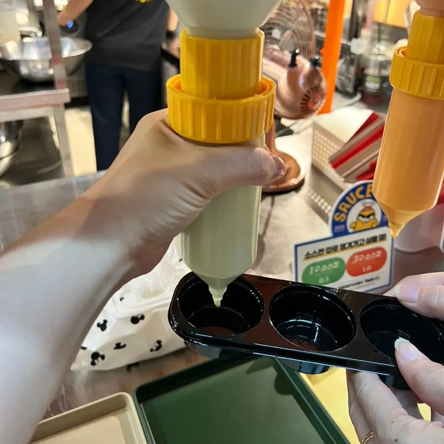 Sauces scooped into a 3-cup sauce container