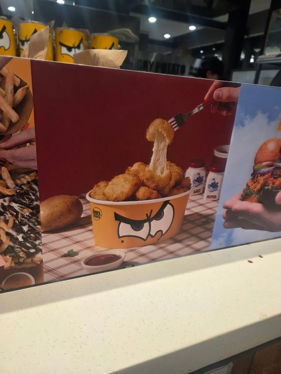 Póster del local mostrando el menú de hamburguesas
