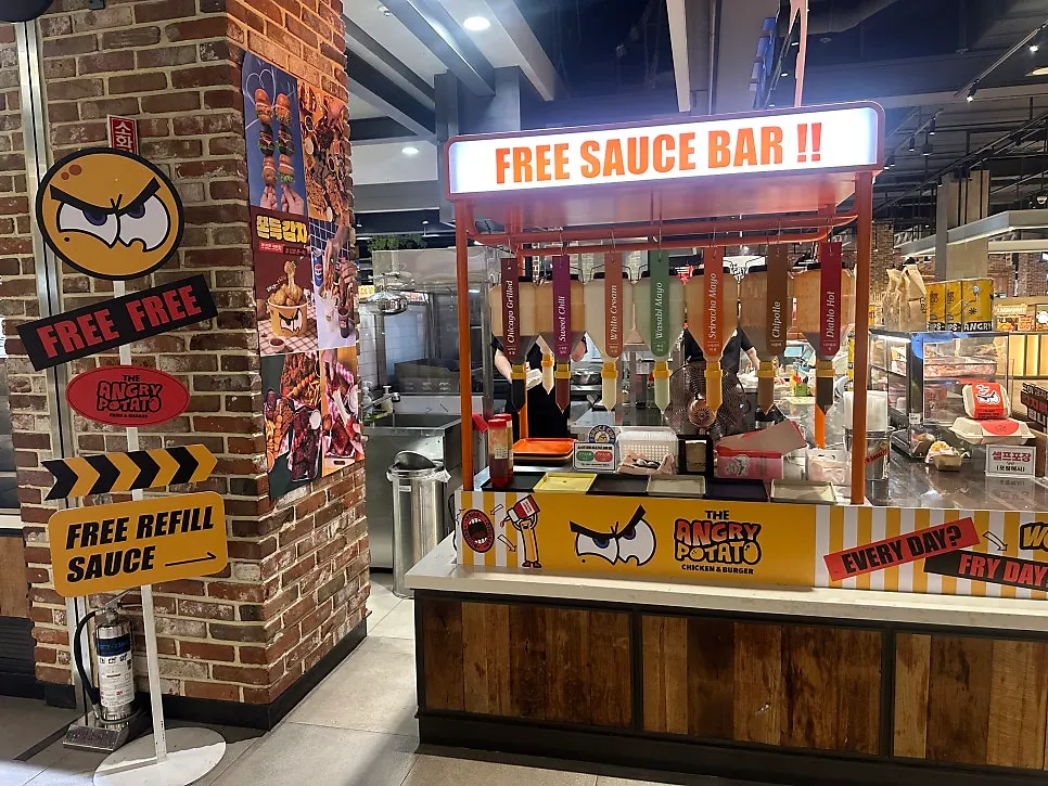 Angry Potato storefront in front of the food court entrance