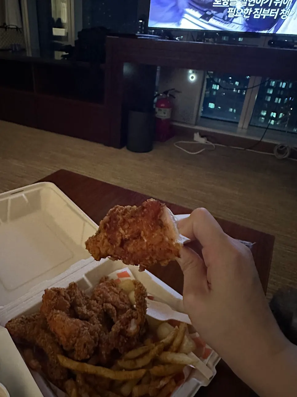 Eating the chicken set in the hotel room