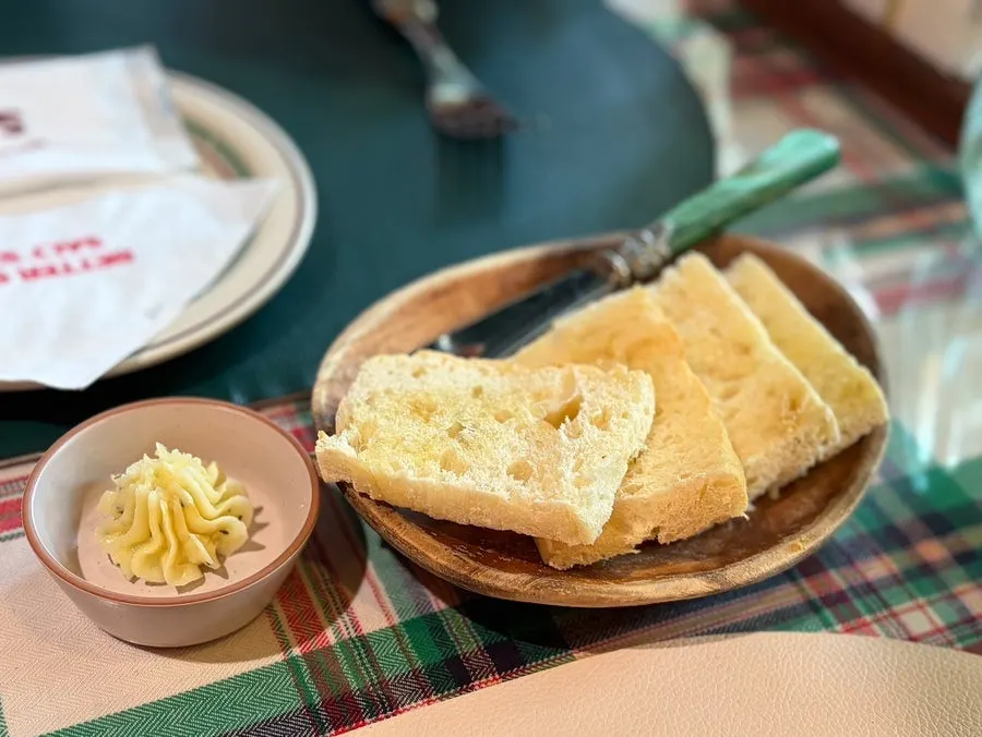 Plate and cutlery set on a checkered tablecloth