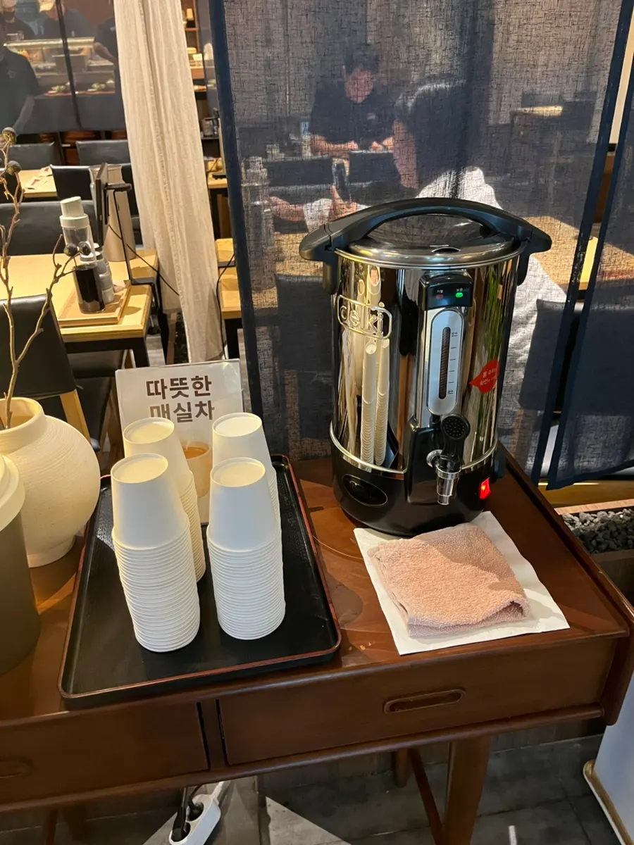 Warm plum tea enjoyed before and after the meal