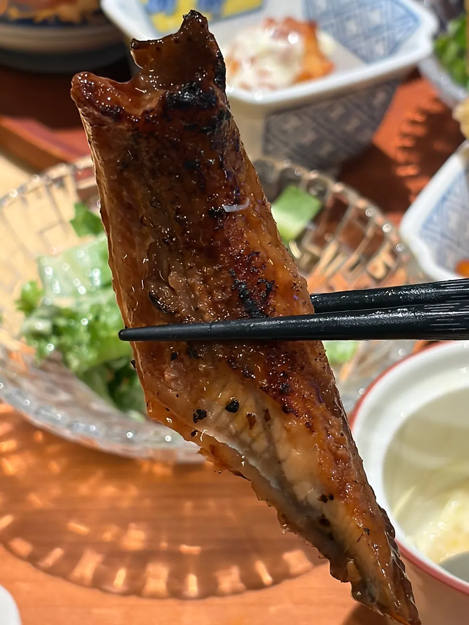 Two pieces of eel sushi compared