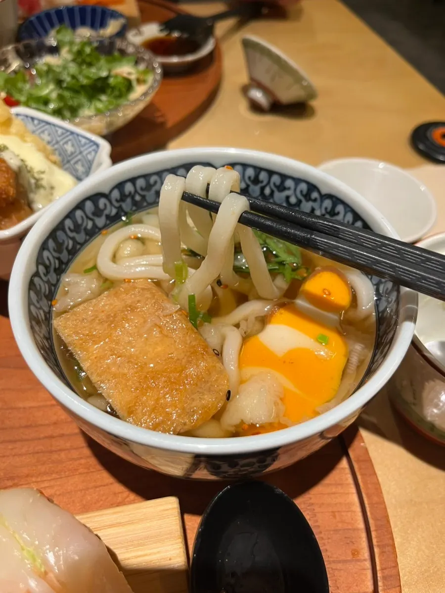 Warm udon served alongside the set