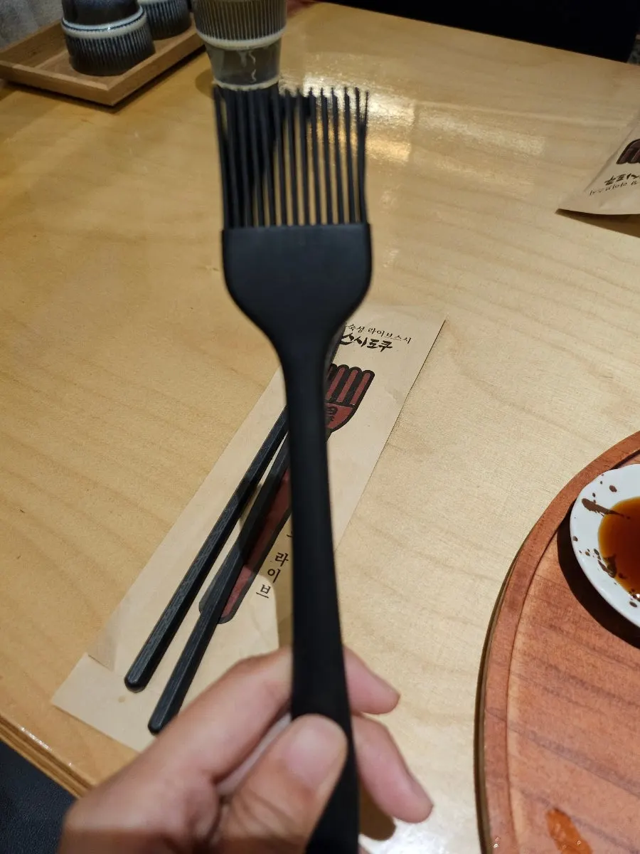 Table setting with a soy sauce brush