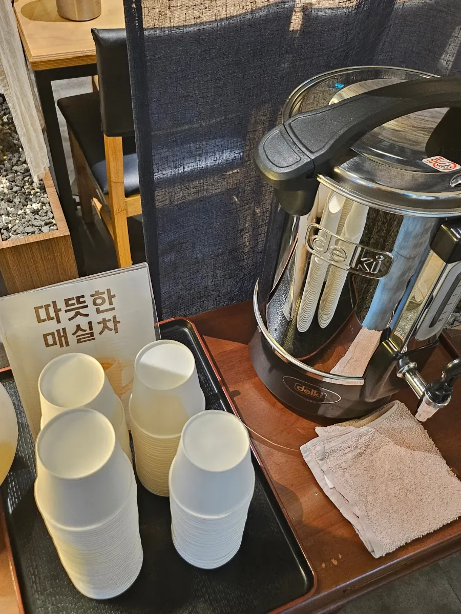 Warm plum tea served after the meal