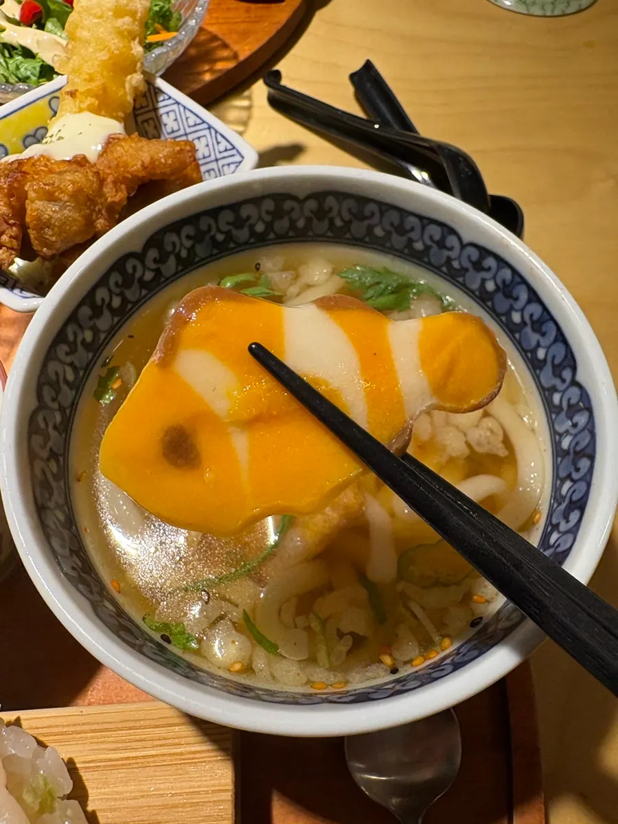 Chewy noodles visible in the mini udon