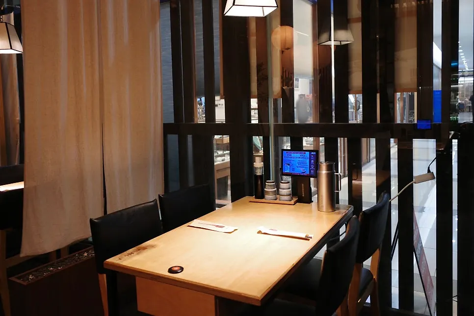 Wood-toned seating with dividers