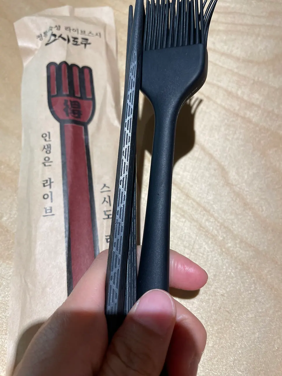 Dining tool for brushing soy sauce onto sushi