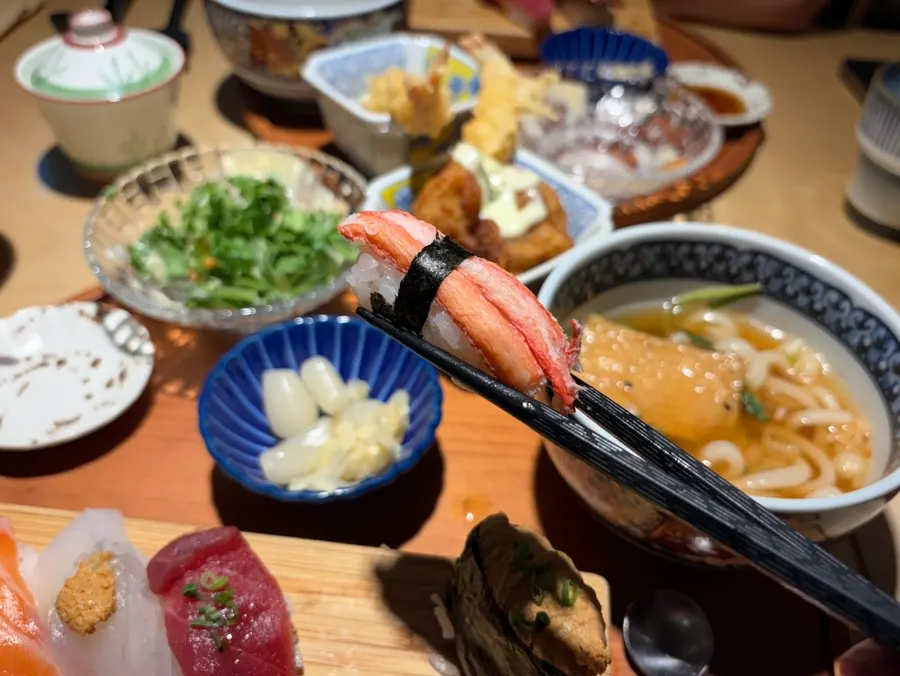 Thick-cut salmon sushi with a long tail