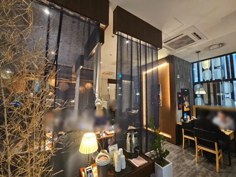 Interior seating at Sushi Doku The Songdo divided by curtains