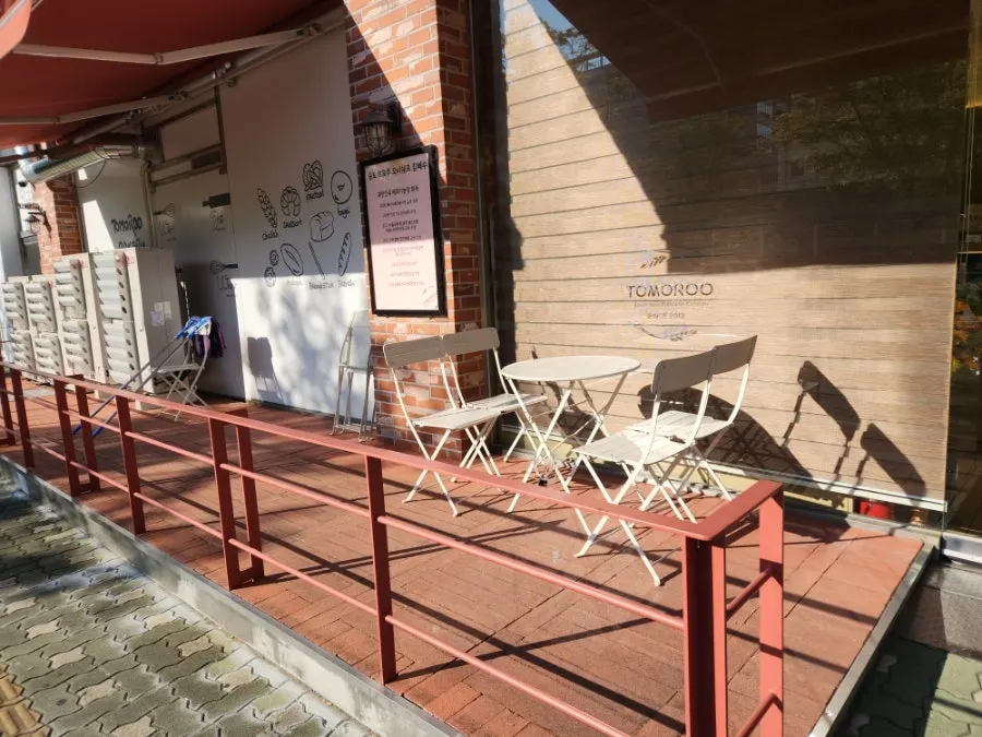 Outdoor terrace seating at Tomoru Bakery