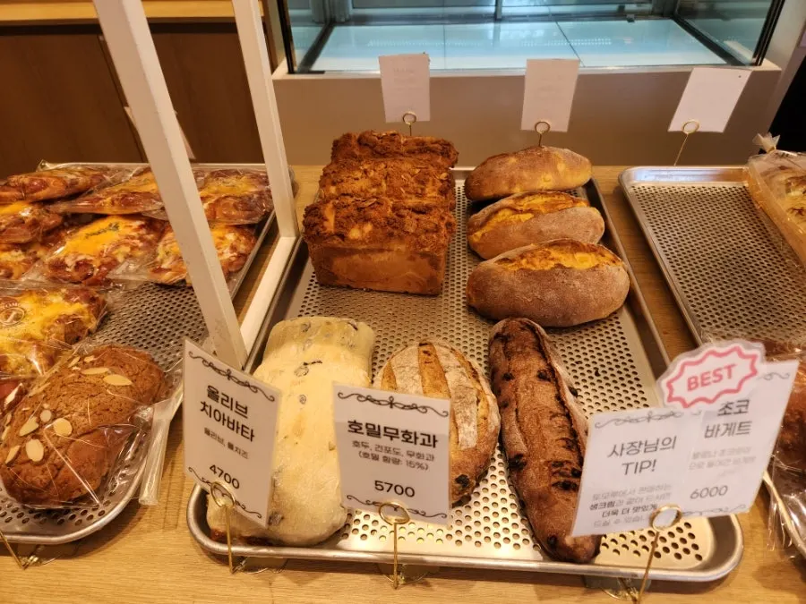 Olive ciabatta and rye fig loaf on display
