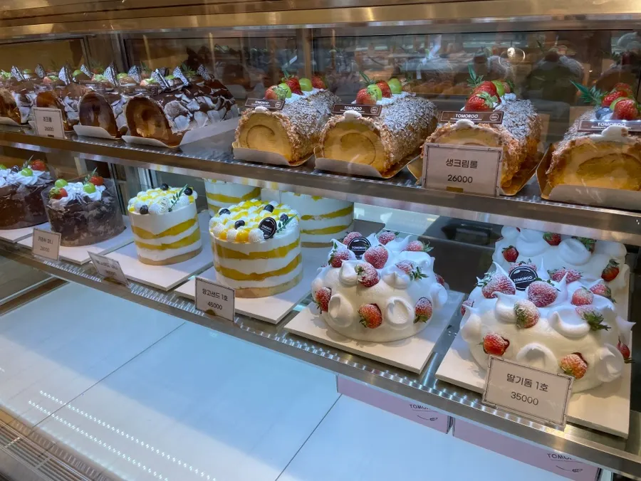 Cakes and roll cakes on display at Tomoru Bakery