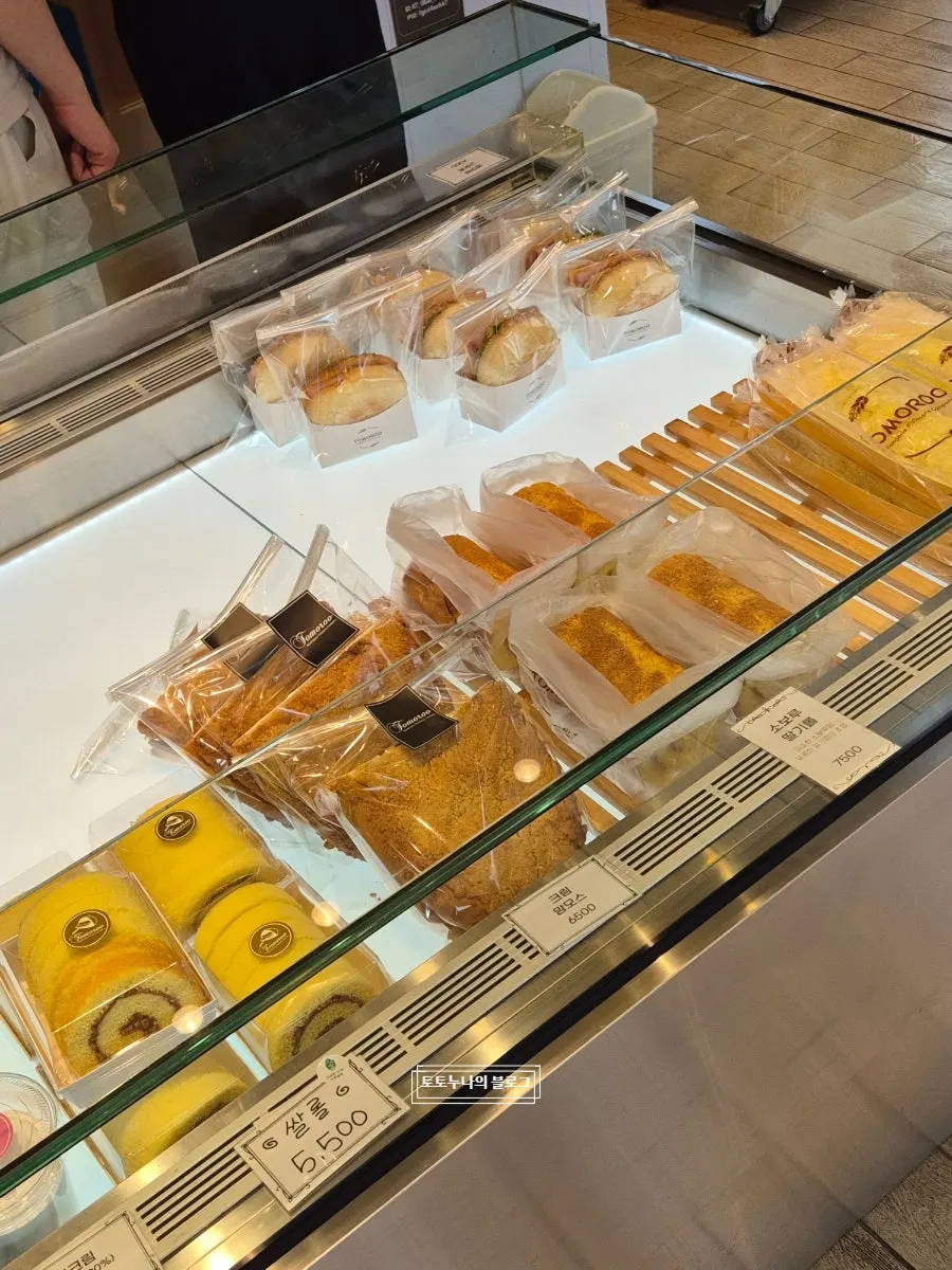 Interior of Tomoru Bakery and its display shelves