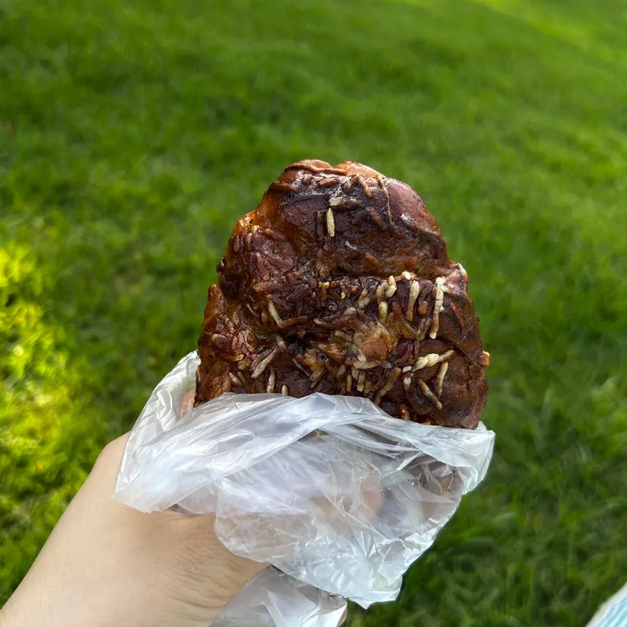 Coconut cream cheese bread photographed halfway through eating