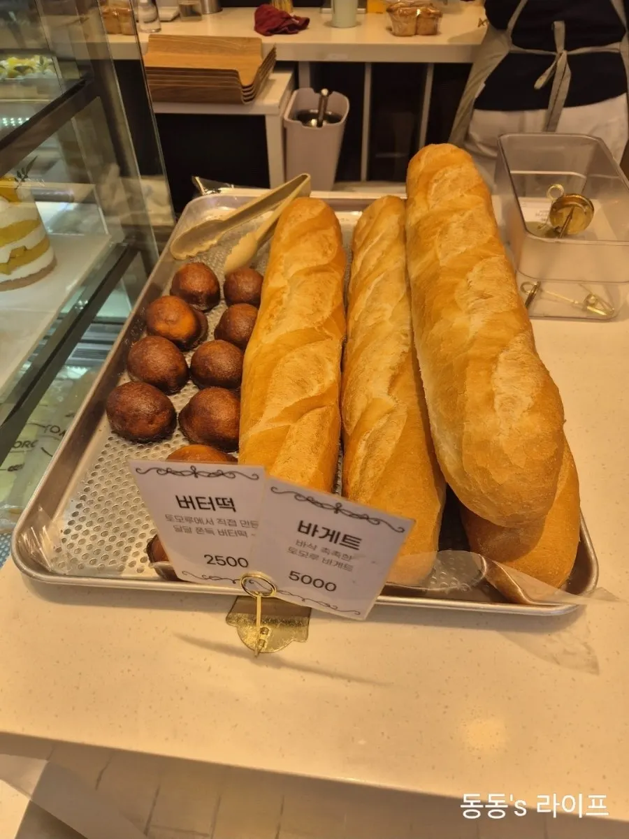 Bakery display case with various breads