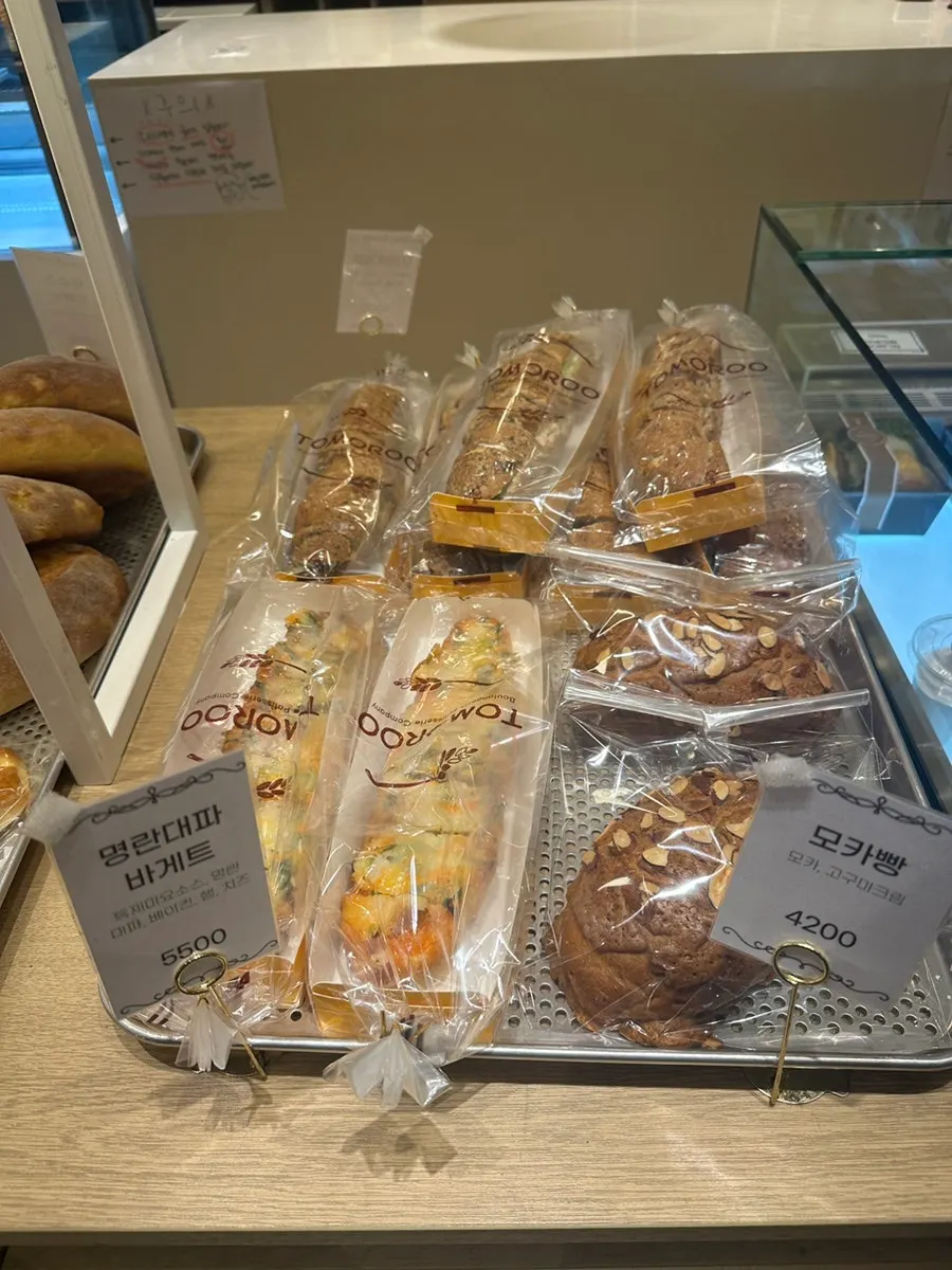 Bread display case at Tomoru Bakery