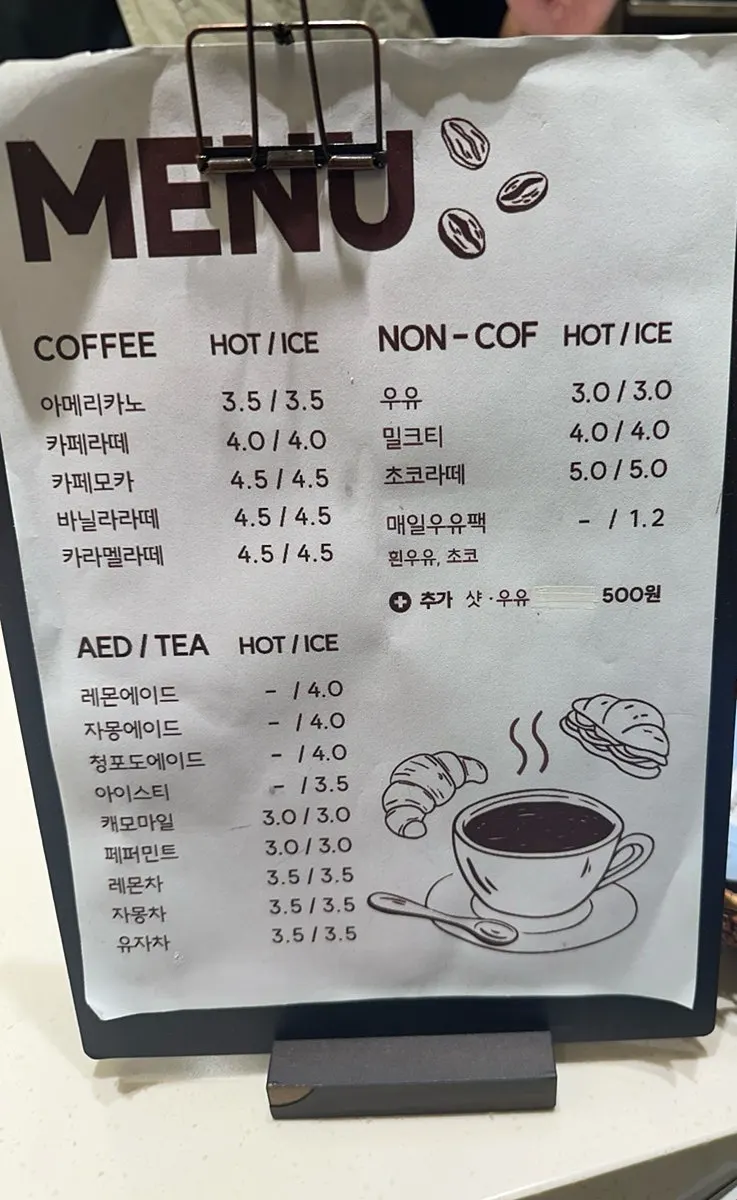 Store sign listing coffee menu