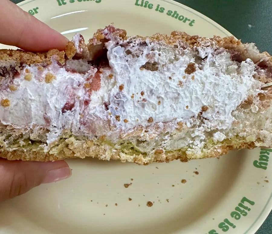 Cross-section of ciabatta studded with olives and cheese